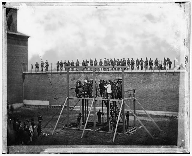 A photograph of the conspirators prepped before hanging