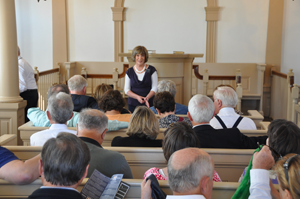 A woman speaks to an audience in Nauvoo, Illinois.