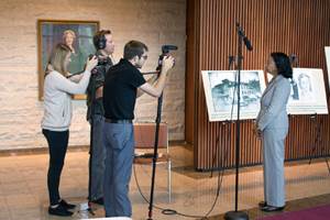 A photograph of Dr. Shirley Portwood Emeritus History Professor, SIUE speaking before reporters